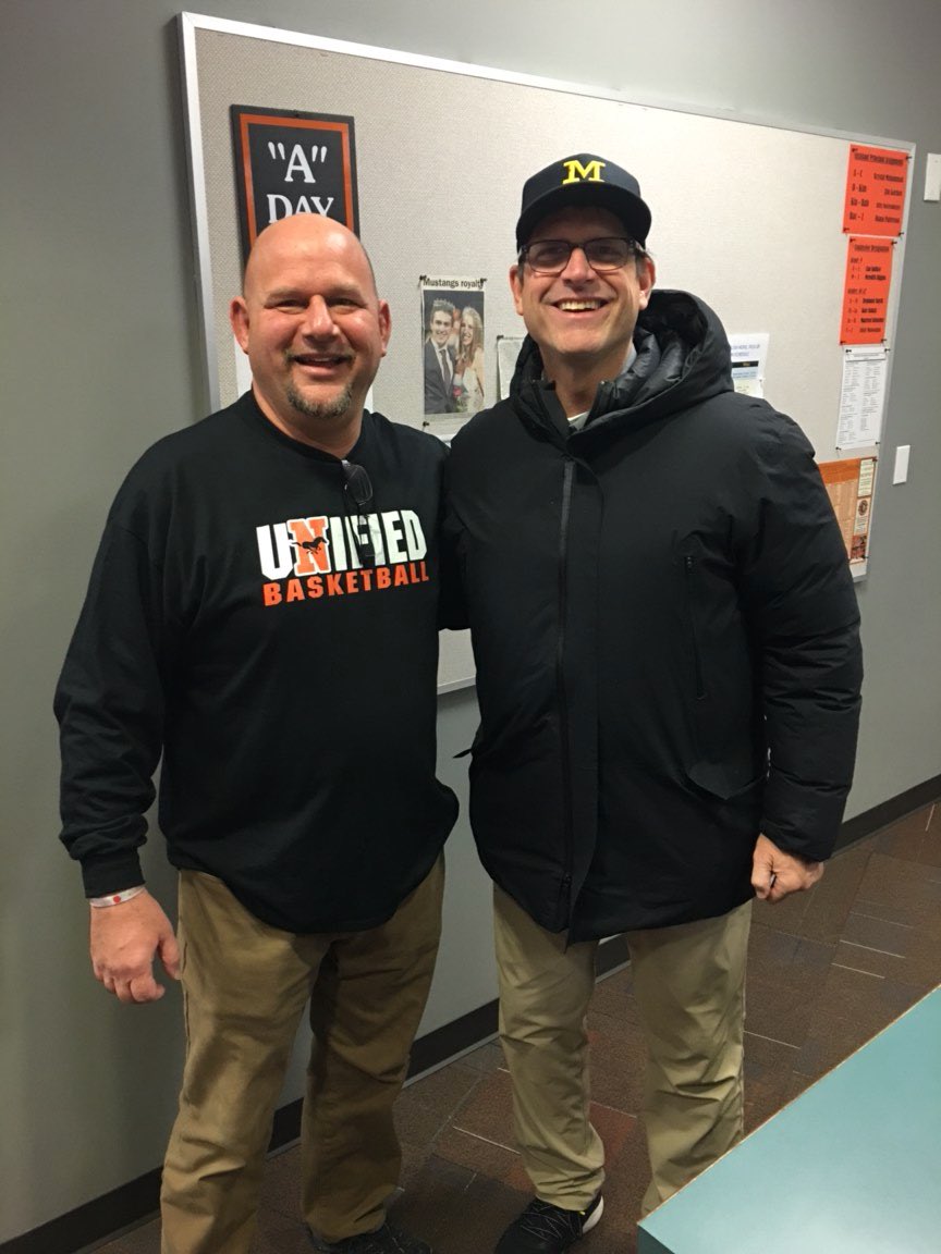 nvilleathletics's tweet photo. Coach Jim Harbaugh in the house. Even took time to sign our Unified Basketball Team pledge “Spead the word, to stop the word” https://t.co/w0yRnxldVr
