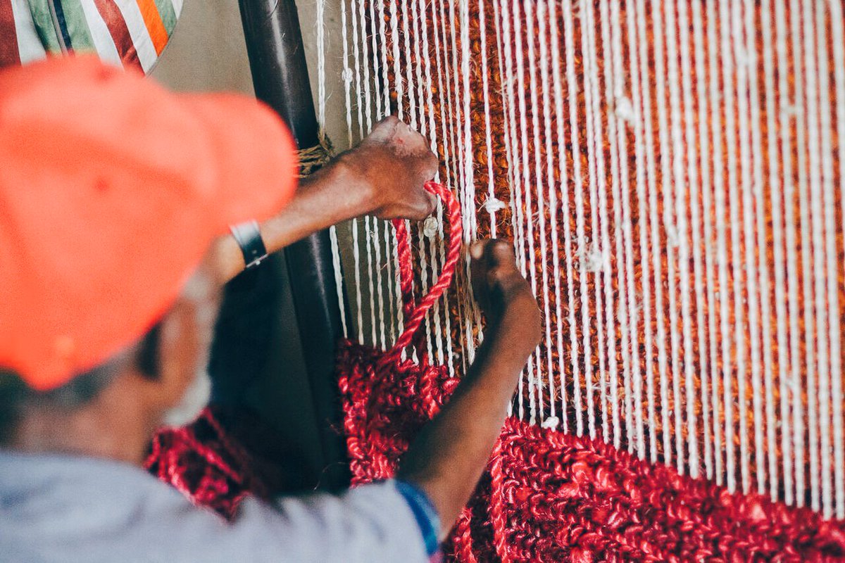 Meet Kassa! Kasha works at Lila Products in Addis Ababa, Ethiopia. He is a leper and as a result has lost his fingers but he doesn't let that slow him down! He shows up early everyday and is passionate about making beautiful rugs! We love this man and his perseverance!