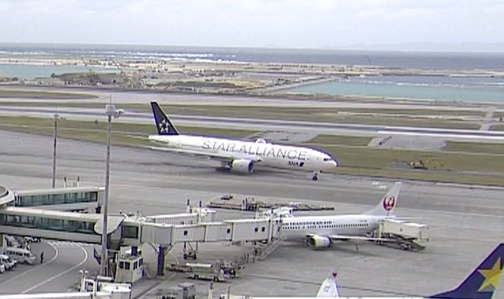 AirportWebcams's tweet photo. ANA All Nippon Boeing 777-200 JA712A in Star Alliance special livery just landed at Naha. Newly-painted 777 JA741A in #Hello2020Jet Tokyo Olympics scheme is also inbound on #NH301. Watch: : https://t.co/xjtOkWwRQu | https://t.co/7fgZhbnq0f https://t.co/hve2jyRdD1