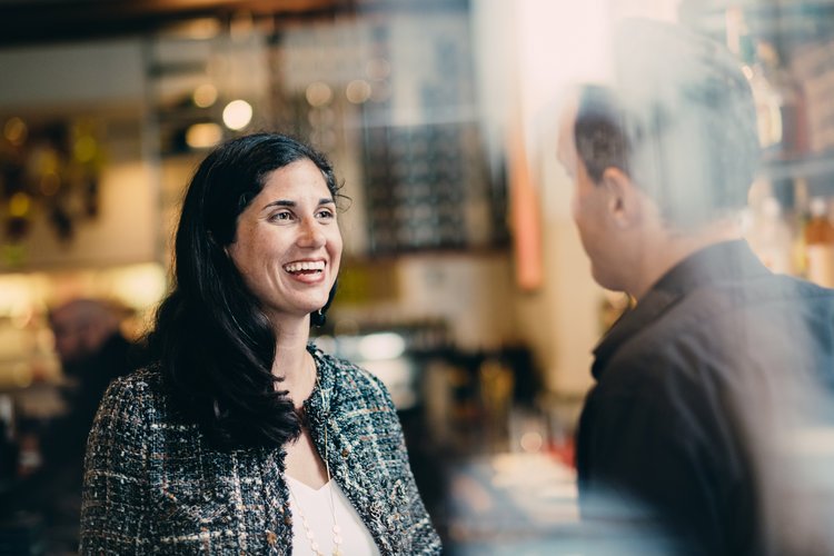 Democrat Nicole Clowney, running for Arkansas state house district 86; image of Nicole meeting a supporter at an event.
