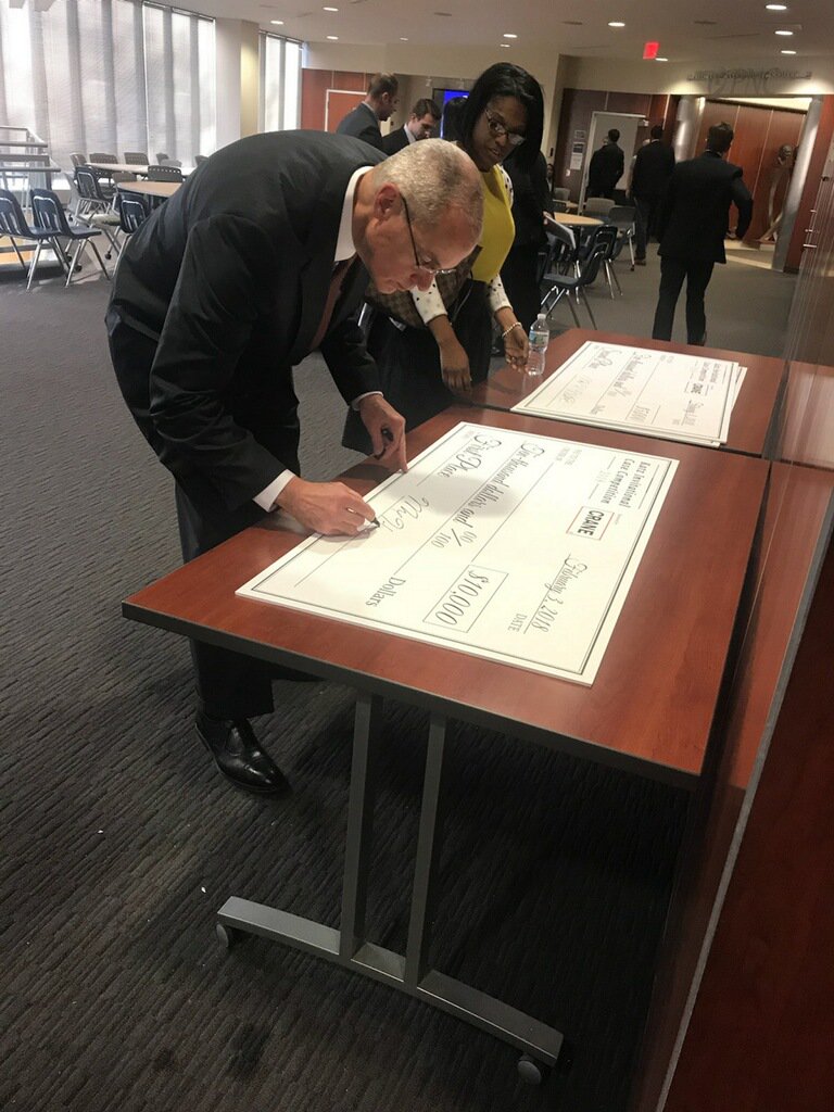 KatzCaseComp's tweet photo. Crane Co CEO Max H. Mitchell prepares the checks for the top 3 finishers. https://t.co/kpOdNvZ42q
