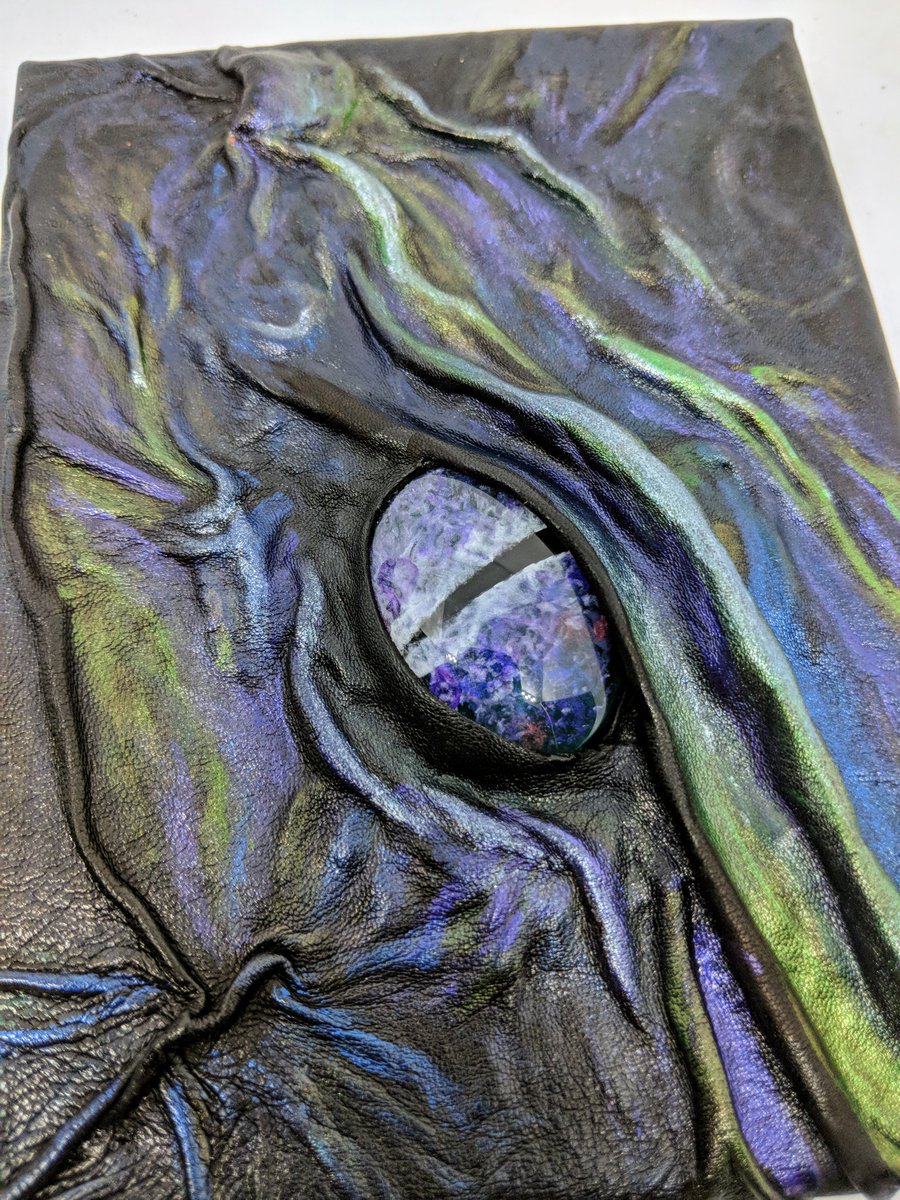 What do you think? A Small 3D Dragon Wall Plaque,  a canvas covered in leather with a Hand Painted Dragon's Eye. Not done these before so would like feedback from you lovely lot please
#DnD #dungeonsanddragons #dragonwallart