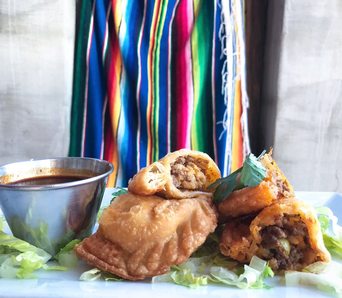 We’ll be serving these beauties all weekend for #SuperBowl-flaky fried Beef Empanadas with mole sauce, 
onions, green peppers, &amp; cumin. #mexicanfood
