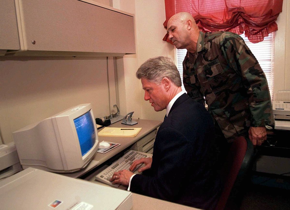 Here's Clinton using a computer at some point in the 90s, while a soldier watches for some reason.