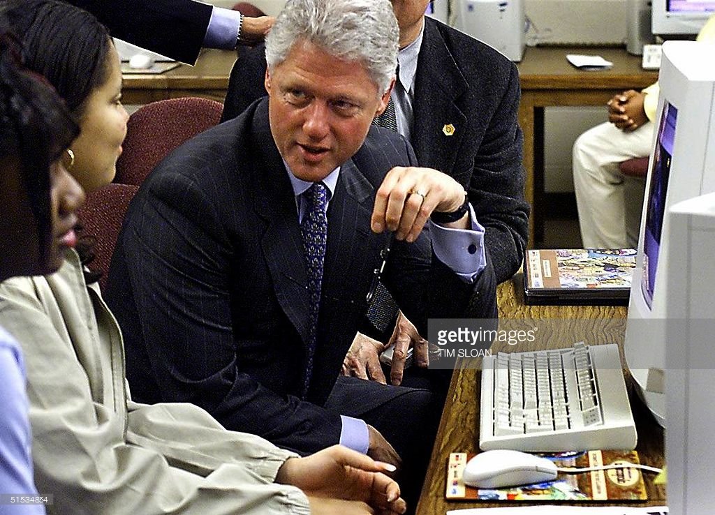 Here's Clinton in a computer lab in 1999, but not doing the trick.