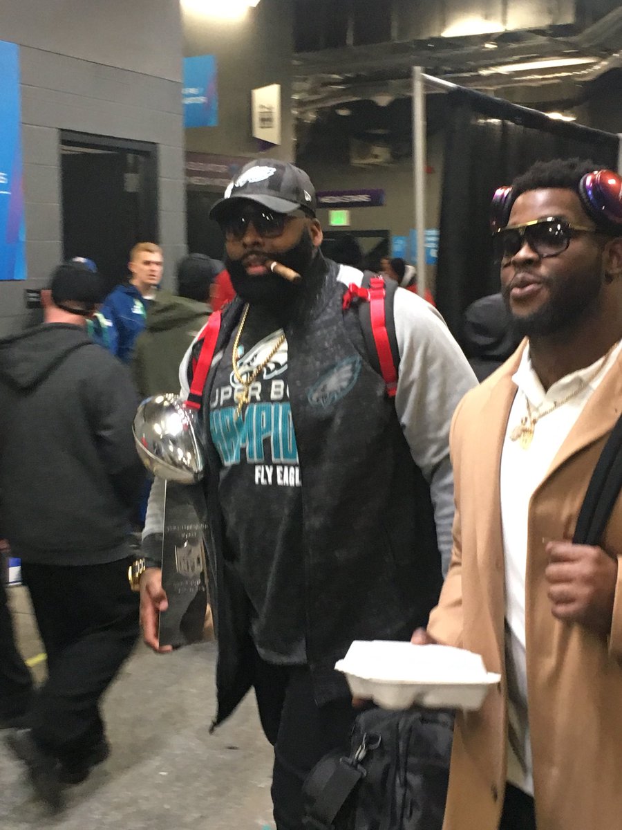 Bo_Wulf's tweet image. One man carries the Lombardi out of the locker room.