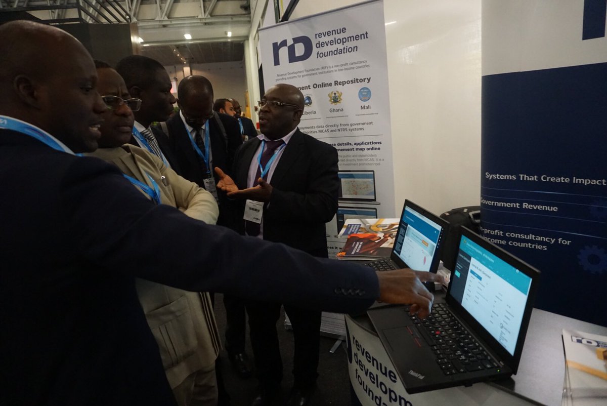 RevenueDev's tweet photo. #RDF Staff @AasmundAndersen and @AbeyieIshmael meet with #Ghana’s delegation and present the #onlinerepository to the Minister. #RevenueDev #MiningIndaba18 https://t.co/M4cWMoBH6y