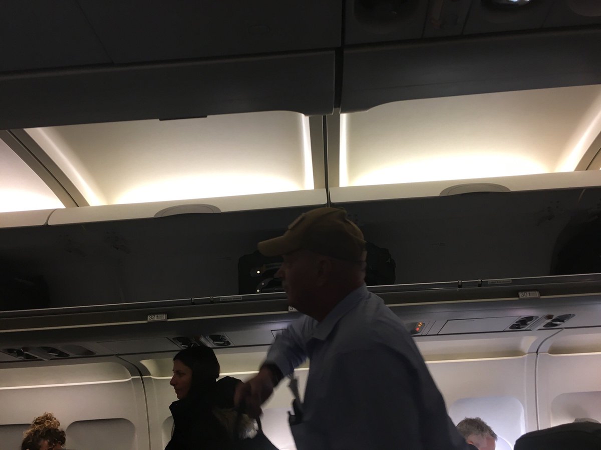 gesserta's tweet photo. Yikes @united - was told when scanning my boarding pass I had to check a bag as overheads were full. Turns out less than half of overheads were full. Photo of those next to my seat. Pull it together! Flight 939 this morning. https://t.co/g6JAFJiAuo