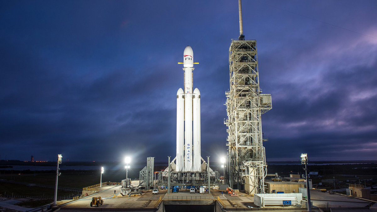 Cmdr_Hadfield's tweet photo. This monster is due to launch 24 hours from now - and those 3 lower rockets will all try &amp; land, to be reused. Worth watching: https://t.co/WEAWAKJgr1 https://t.co/DqGfyzTLVn