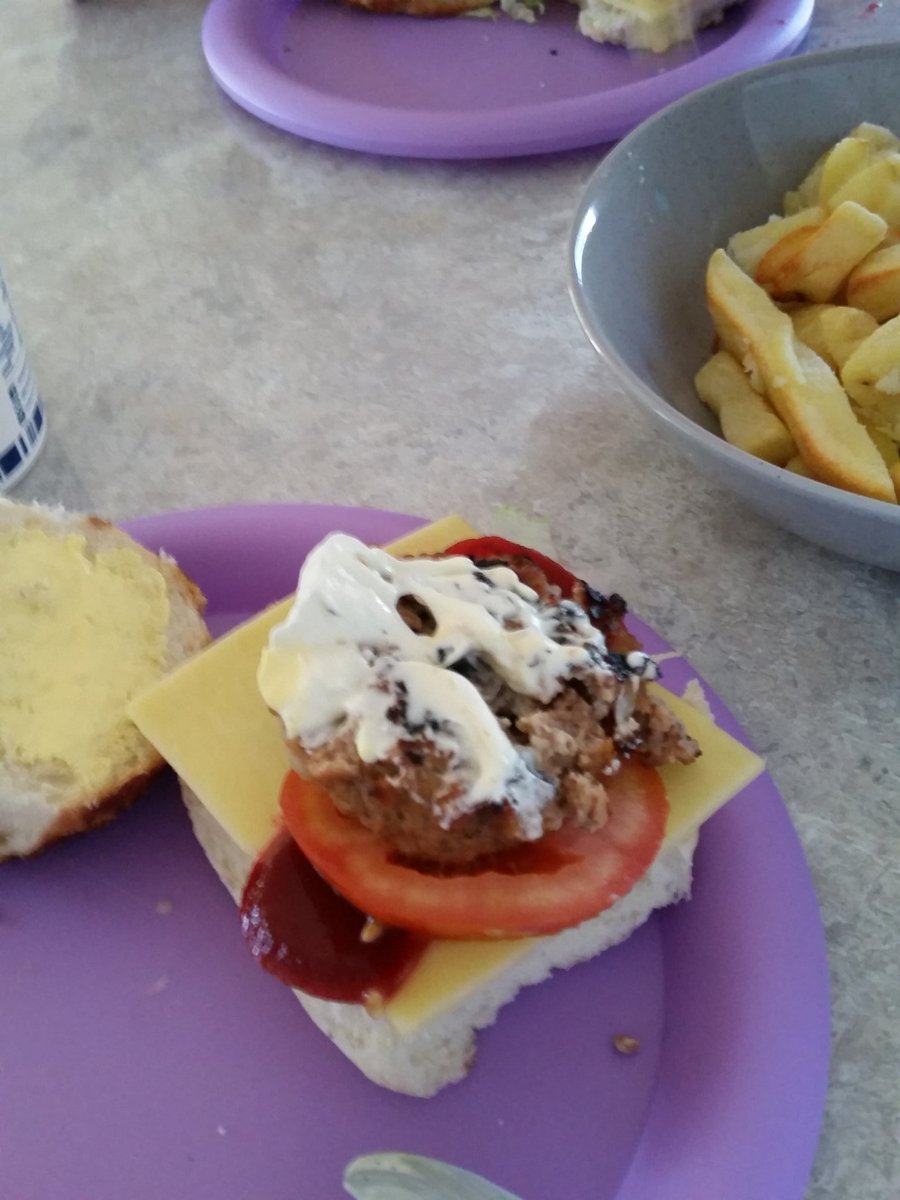 Homemade  hamburgers  with  sour  cream  and  chips