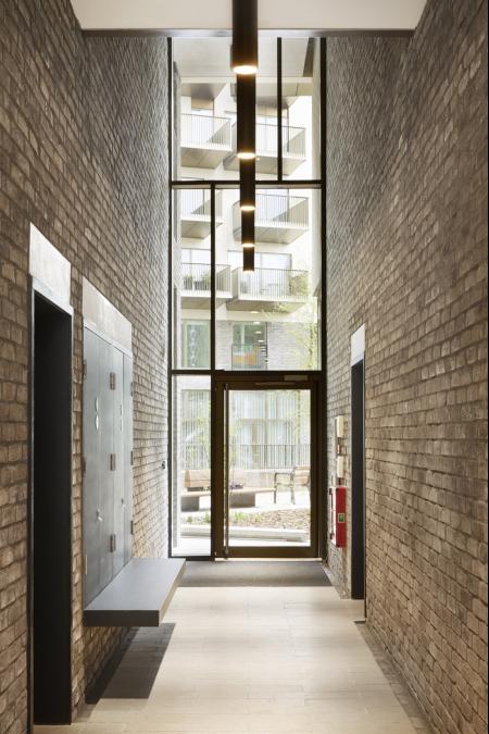 BETON concrete lintels supporting the doors of Rathbone Market, Canning Town #beton #concrete #bespoke #architecture #architectural #interiors #design #development #robel