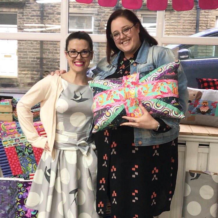 madewithmadness's tweet photo. Meeting the wonderfully colourful @TulaPink today at @SimplySolids wearing my @sewoverit #betty dress in #freefall with my #unionjack cushion, #quilt #bunting and other bits of mine in the background- #bestdayever #handmade #janomemakes #aurifil #tulapink #simplysolidsmakes https://t.co/xfHy59wZwo