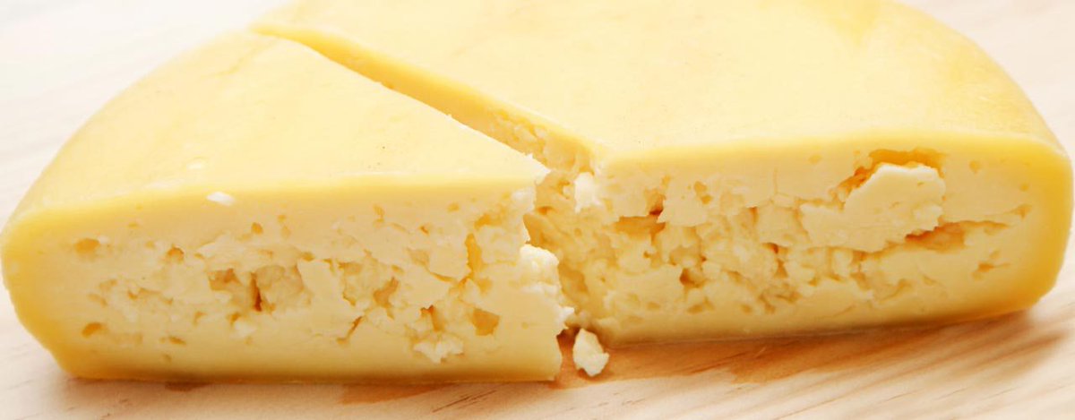 Queijo São Jorge - a firm, slightly waxy texture that envelops an open, straw-coloured paste. Flavours are mild, full and buttery with an underlying tang that becomes more obvious with age.