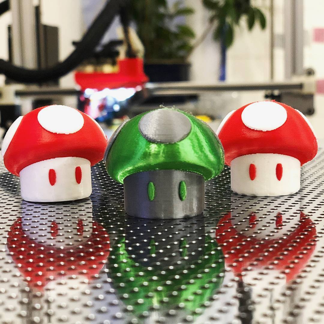 More dual extruder fun time with these Mario desk shrooms (thing: 1375575) by <a href="/AndrewBougie/">Andrew Bougie</a> . What a perfect way to test dual extrusion in #Cura on the #gCreate gMax 1.5+ with E3D all-metal hotends! Check out andrewbougie.com to see his more of his great work! #3dprinting
