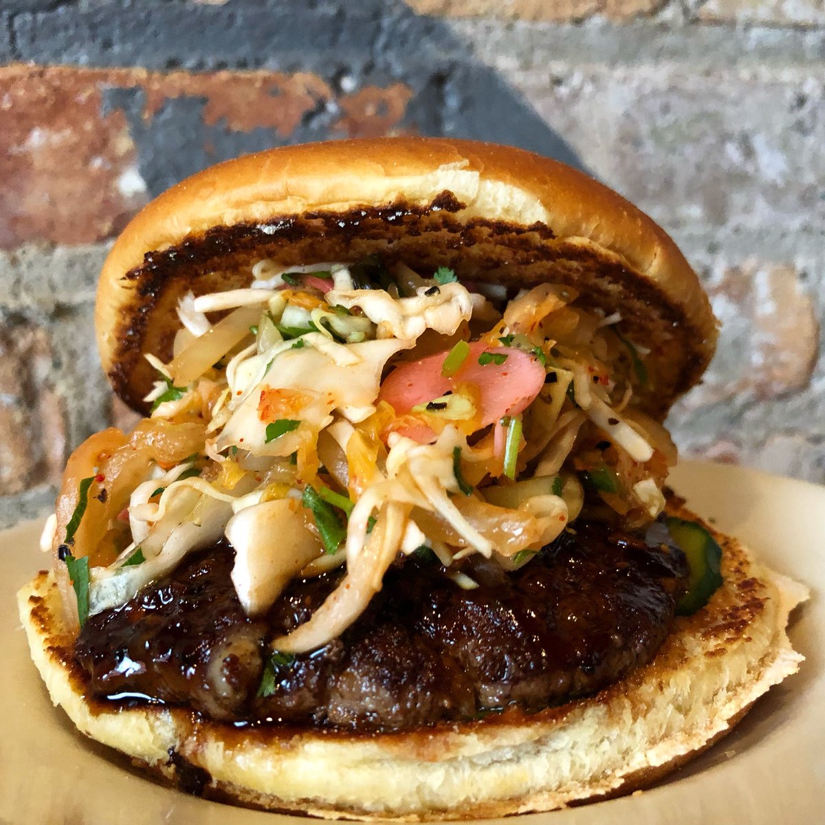 Take a bite out of February’s #15...The Korean BBQ Burger | Grass Fed Beef, Marinated Cucumber, Korean BBQ Sauce, Kimchi &amp; Cabbage Slaw. Enough said. 🤤