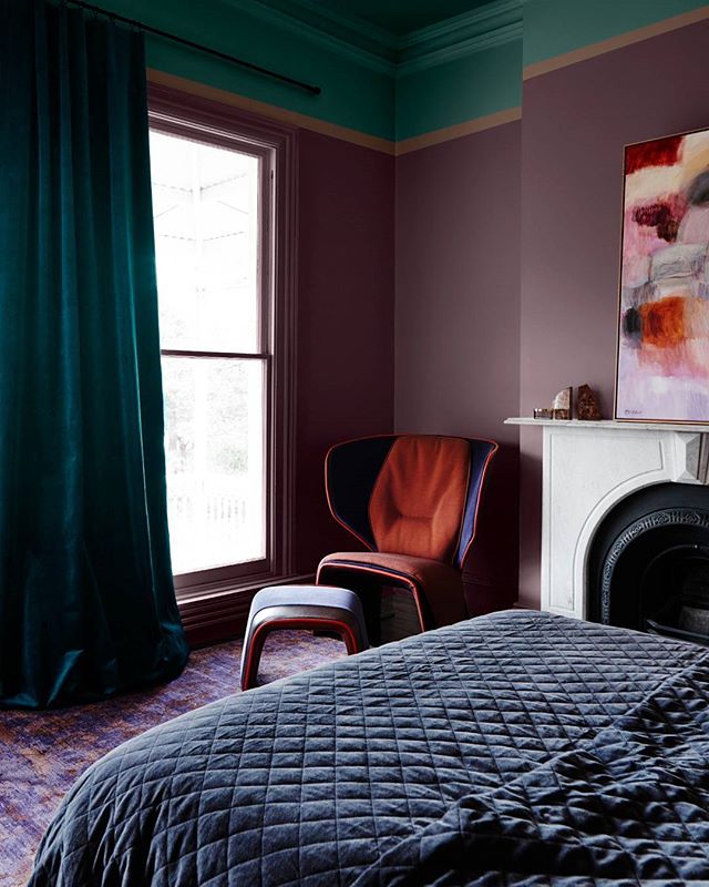 A vibrant and cozy bedroom featuring the Cassina Gender armchair for the Dulux Reflect Colour Forecast 2018. ⠀