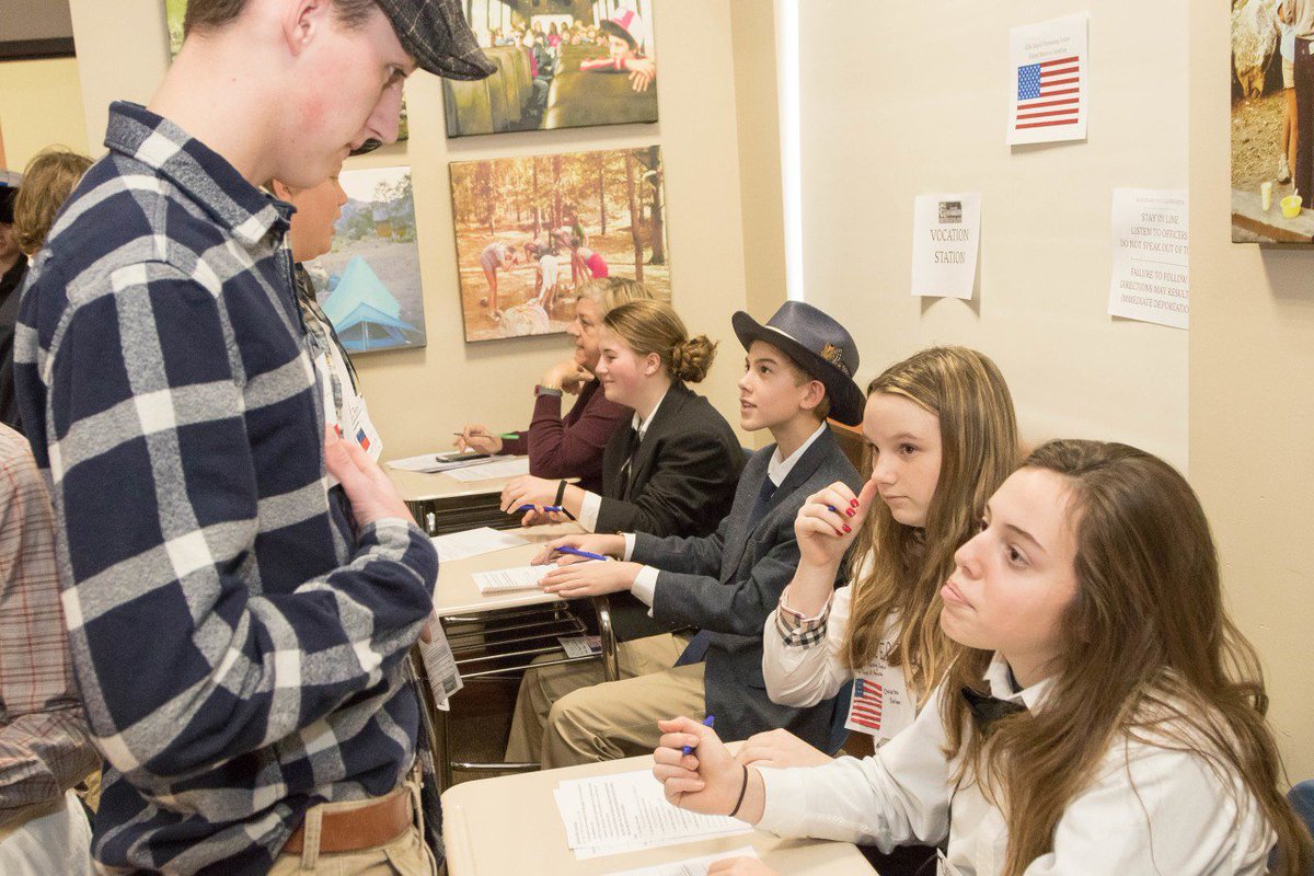 Ensworth's tweet photo. Patton Hall Commons transformed into Ellis Island for the annual Grade 8 simulation last week. Students are randomly assigned the role of immigrant or officer, complete with character profiles & life histories. Quite the powerful exercise for all participants. #CoreSkillBuilding https://t.co/acgXmQJpLE