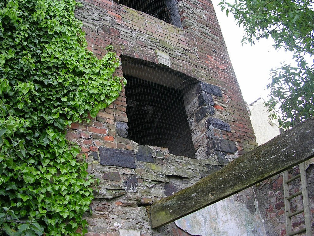 In the 19th century many houses around Britain were built with copper-slag bricks, but it was especially useful for spots that required the very hardest material: quoins, foundations, roadwork, etc. Much of it remains, but is covered in stucco and can be tricky to find.