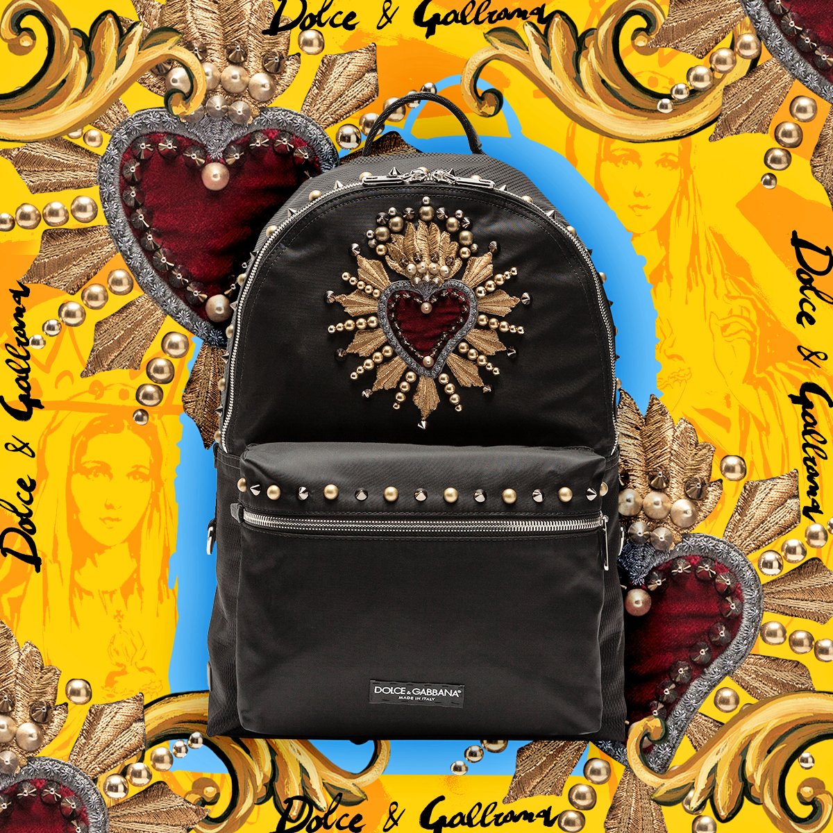 Dolce Gabbana on X This black backpack is embellished with several gold and silver studs around its main compartments. A large red sacred heart patch features in the middle an emblematic
