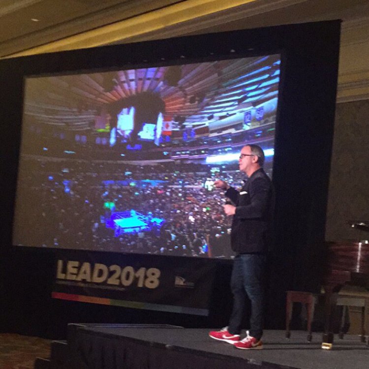 LEADHRAwards's tweet photo. Lonnie Mayne on stage, with “Red Shoes Living”: revealing the secrets to recruiting, retaining, and getting the best out of your people. #aworldinspired #LEAD2018 https://t.co/PQqAlpkXsk