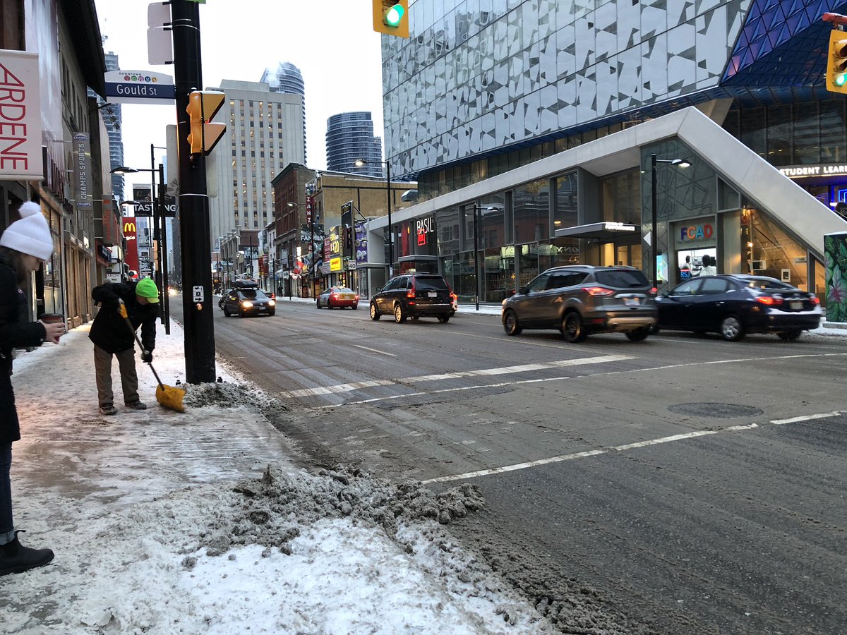 DowntownYonge's tweet photo. Snowy mornings mean our #CleanStreetsTeam is out making crosswalks safer for pedestrians – here’s team member, Juan, in action! #YongeCleans https://t.co/LE6h5RK3kM