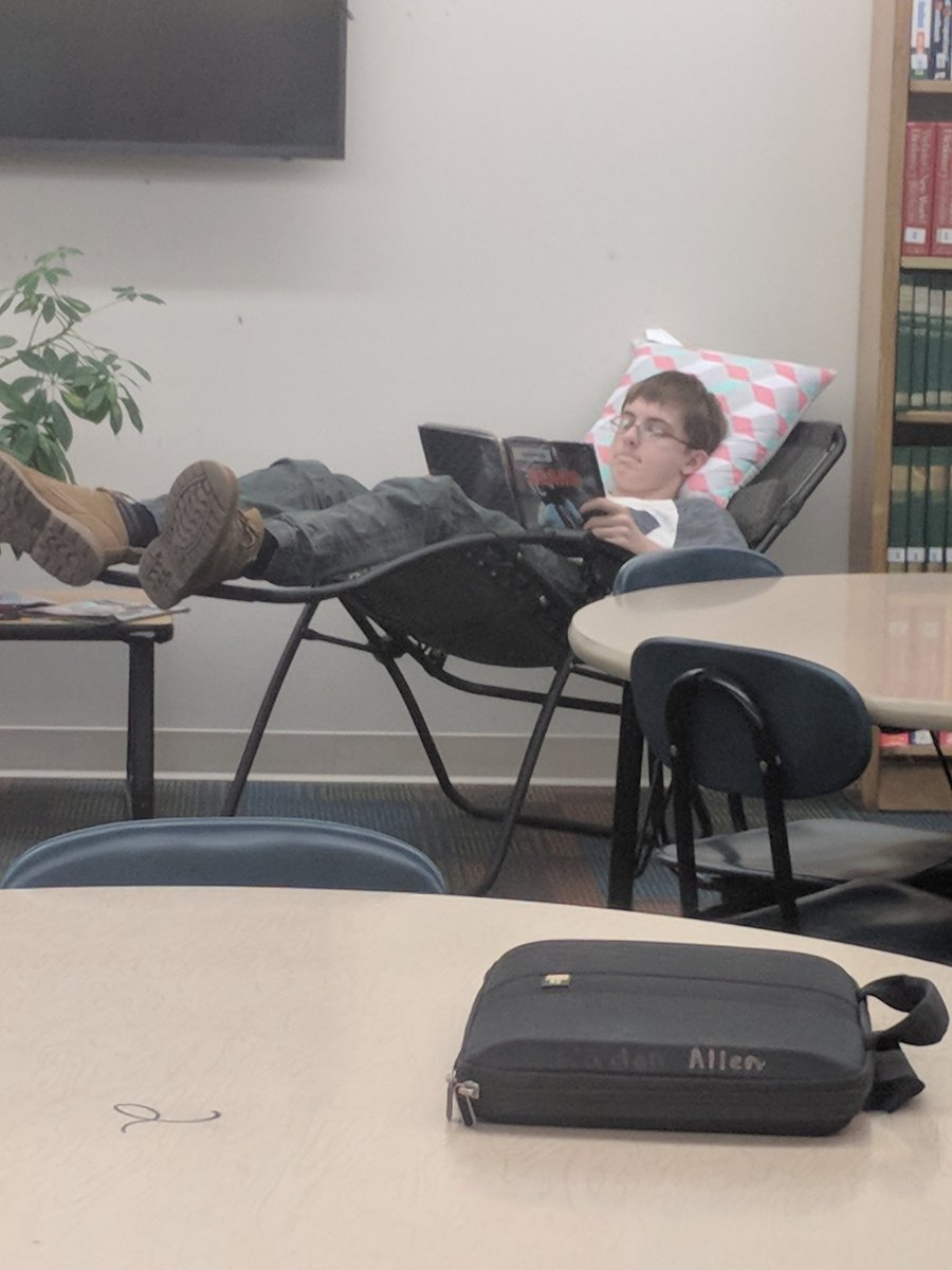 LeesaFarmer's tweet photo. Nothing like reading a good book while relaxing during 8th grade library time. #wearelombard #lombardlibraryrocks https://t.co/lVpeQDAwE5