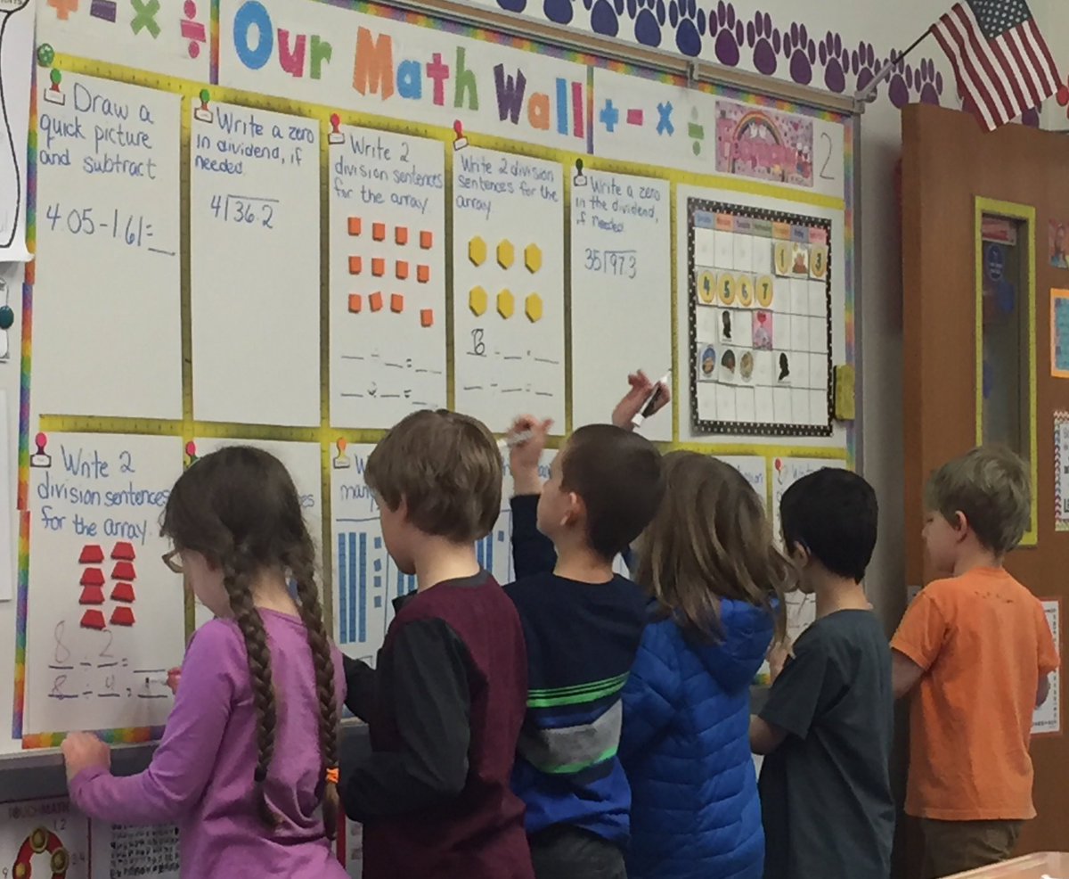 Third-graders working on division on the “Math Wall” to start their day! #beartavernpride