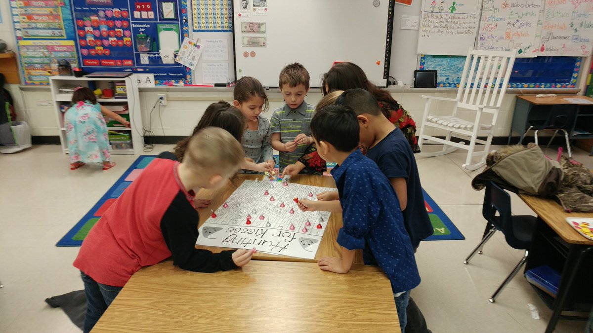 SzobotasClass's tweet photo. Hunting for Kisses game! It's a great way to learn your numbers to 100 without a PowerPoint or worksheet, and who doesn't like eating all those Hershey Kisses afterwards! π¬π§‘ #FESKindnessChallenge #FESFamily #FES2017 https://t.co/5KPXlxgj2S