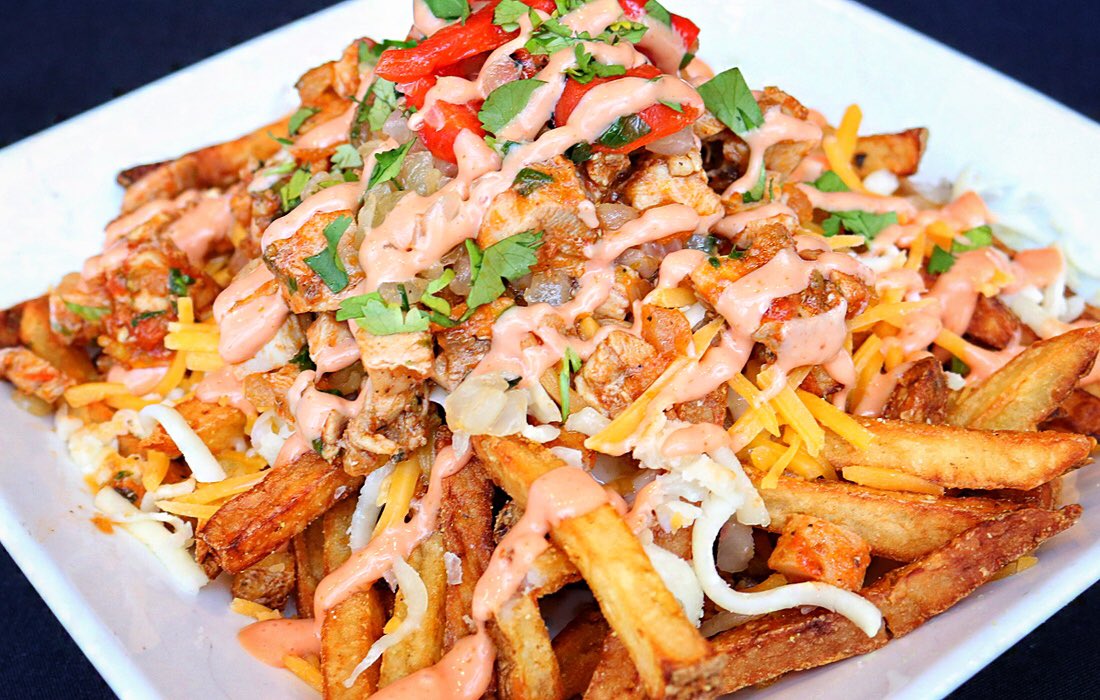 FieldHouseFoods's tweet photo. These Loaded Adobo Fries are amazing! Topped w/ chicken, cheese, peppers/onions and a delicious’ness sauce! Swing by LAUNCH at Sec 126 before heading to your seat. Go @Cavs! https://t.co/B4QjIuTxAY