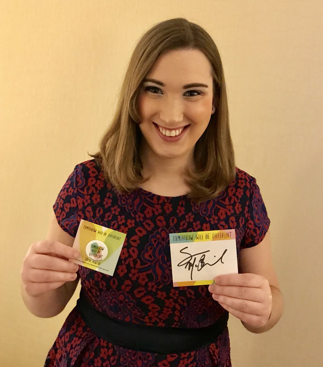 Sarah McBride with a button that reads "Tomorrow Will Be Different" and a signed bookplate.