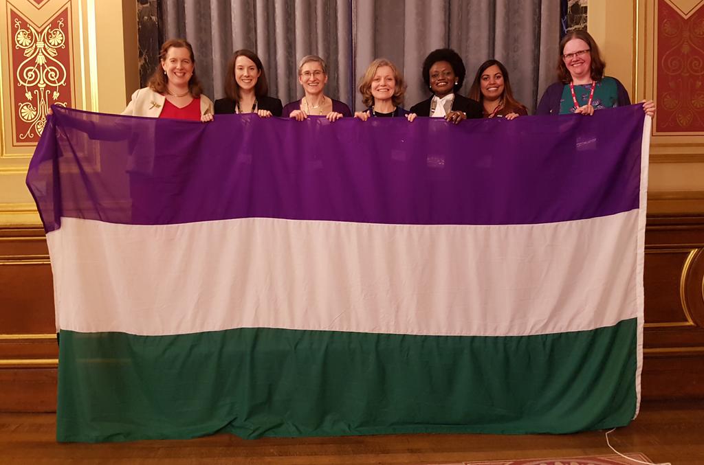 ClareMoriarty's tweet photo. Here's the fabulous #teamDefra with the @SuffrageFlag before it sets off on its travels. Featuring stars of #suffragecentenary launch @marathonshine @KeelaShackell @EmilyHMiles @amandaelahi and those of us who watched in awe! #followtheflag https://t.co/NmSzHdxXfT