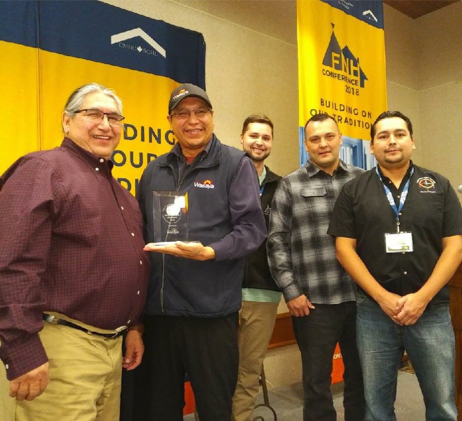 FNHComm's tweet photo. Congratulations Rainy River First Nations! They’ve earned the Community Recognition Award for the building of two new high-efficiency duplexes. #FNHC2018 https://t.co/abZySO2D2C