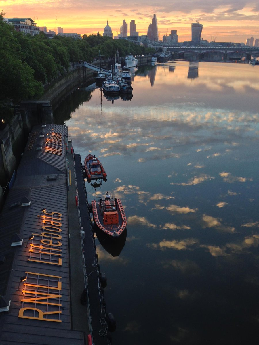 RNLI's tweet photo. Thought we'd share this beautiful morning sunrise of the London skyline to start your day. Almost a near perfect reflection of the clouds above with @TowerRNLI looking ready for service. https://t.co/9kz10l0jTY