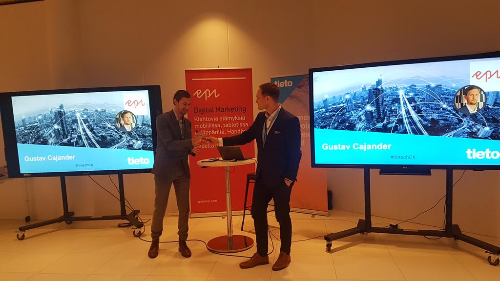 epipetri's tweet photo. Passing the remote to @CajanderGustav at the #fintechCX event organized by @episerver and @TietoCorp in snowy Finland. https://t.co/qUn6JFO4EW
