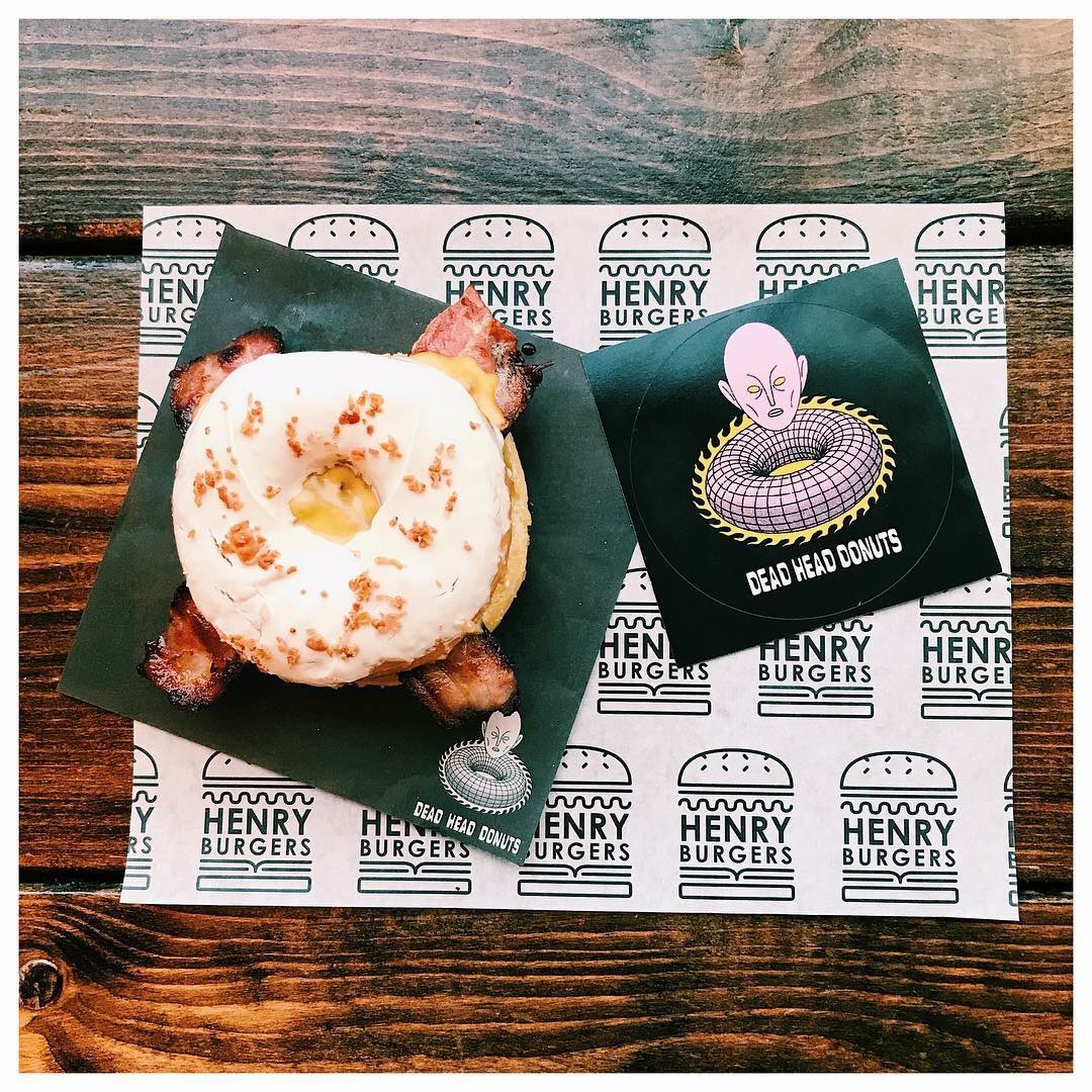 Take us to your leader,HB have joined forces with local doughnut connoisseurs @deadheaddonuts for a special edition burger: 155g Beef patty, American cheese and smoked bacon served in a donut topped with a homemade caramel &amp; maple bacon glaze #HenryBurgers #DeadHeadDonuts #🍩 #🍔