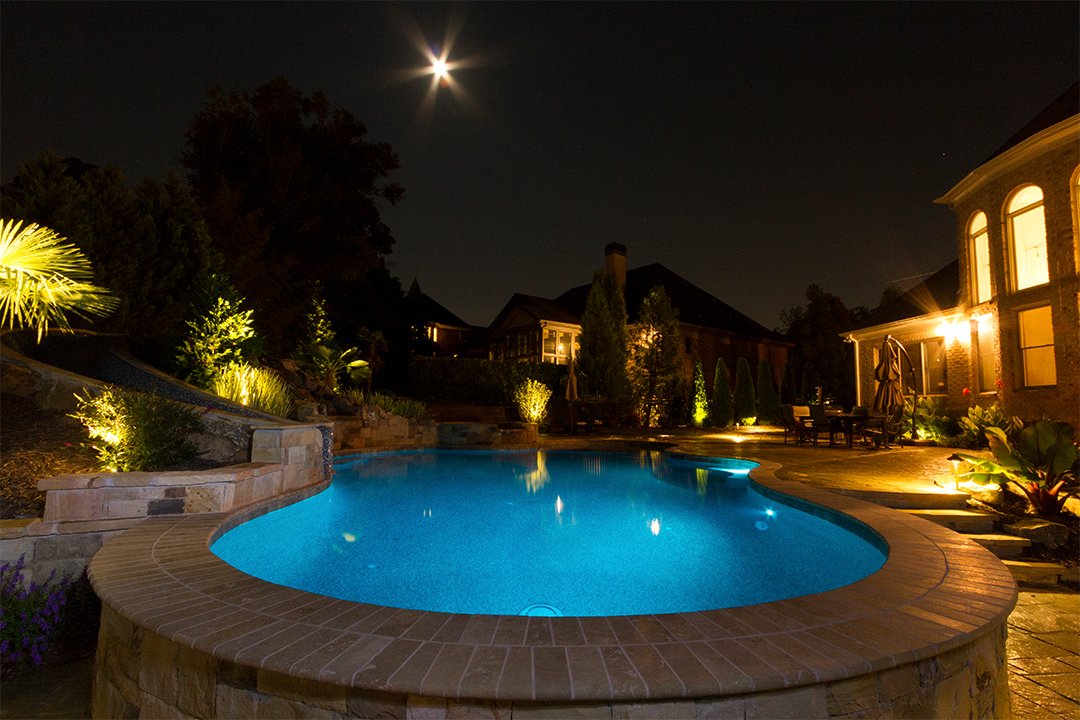 Outdoor LED lighting makes this pool as inviting at night as it is during the day.
