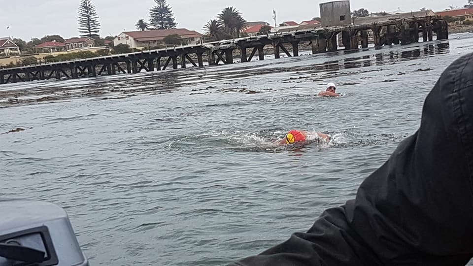 TheAlexaTrust's tweet photo. @ToniEnderli and Howard Warrington in action swimming from Robben Island to Big Bay.  Sporting a trust swim cap.  Swimming with @bigbayevents #TeamAlexa #openwaterswimming #supportingparents #nnu #nicu #neonatal https://t.co/x7hqtkuO3G
