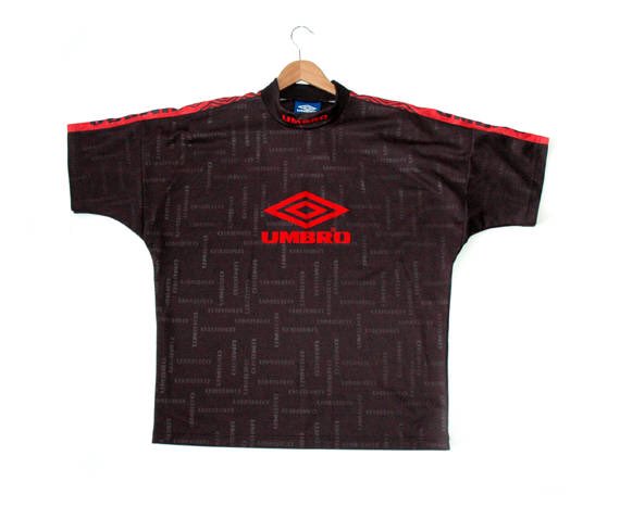 jaykreative_'s tweet photo. Excited to share the latest addition to my shop: Rare 90s Black Umbro Football tee #black #footballtee #unbro #90s https://t.co/gsMWNLesij https://t.co/wbxbPIaNJi