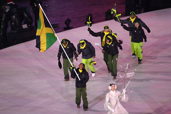DIGICELJamaica's tweet photo. JAMAICA! 🇯🇲
The Jamaica Winter Olympics team enters the Opening Ceremony of the PyeongChang 2018 #WinterOlympics Games in true yaad style.

Watch the Winter Olympic Games LIVE on @SportsMax_Carib, SportsMax 2 and #PlayGo from Feb 9-25. https://t.co/hnAIJ5NpA0