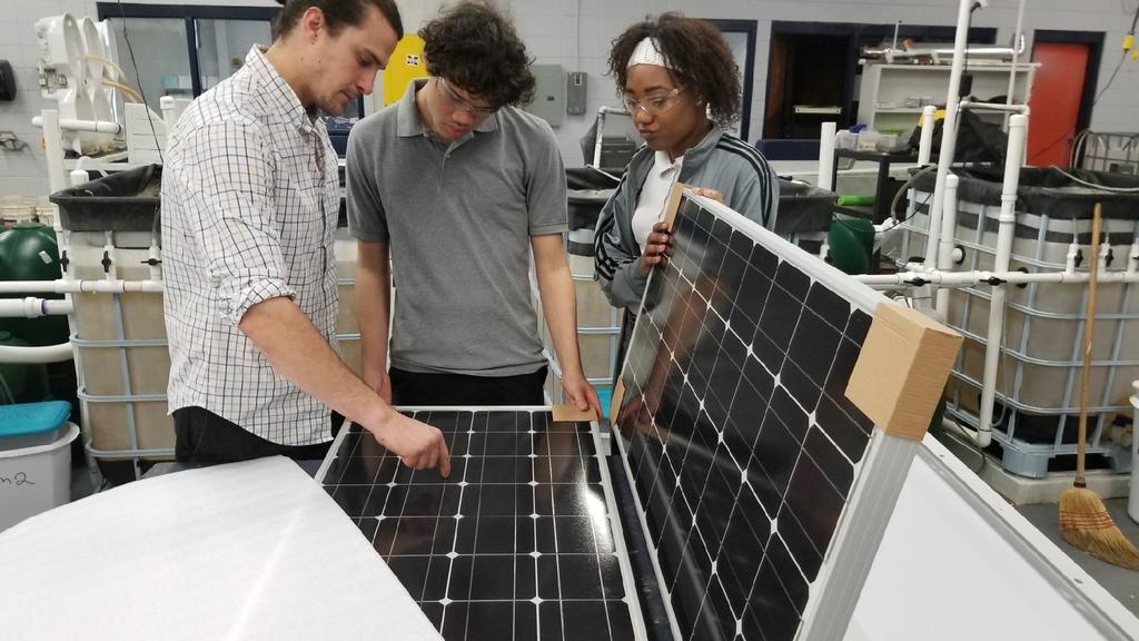 Aquaculture Instructor, Ignacio Lopez, explains how the solar panels will capture sunshine and convert it to usable energy. The students are preparing to compete at the National level in the Samsung Competition. GO TIGERS!!!