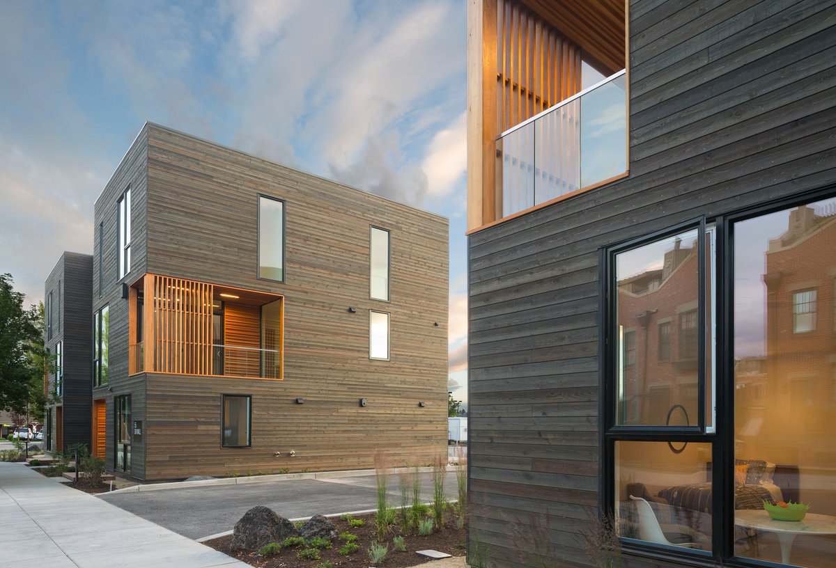 UCSGlobal's tweet photo. Weathered Cedar and warm Pine wrap these townhouses which are geared towards residents who enjoy Oregon's wealth of outdoor pursuits https://t.co/Q6hzHzlC6X https://t.co/8V04OMQKSd