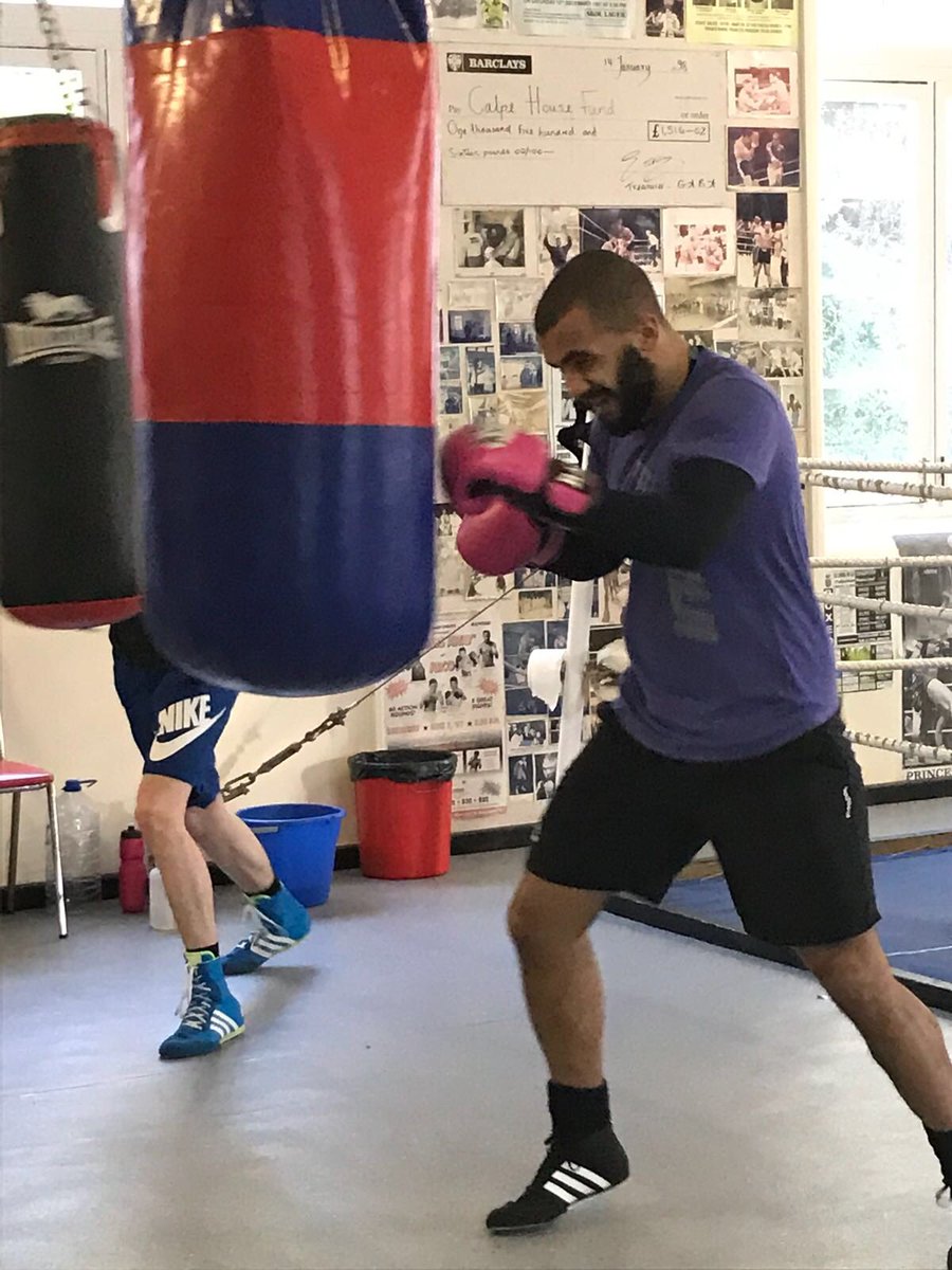 Another boxer punching punch bag.
