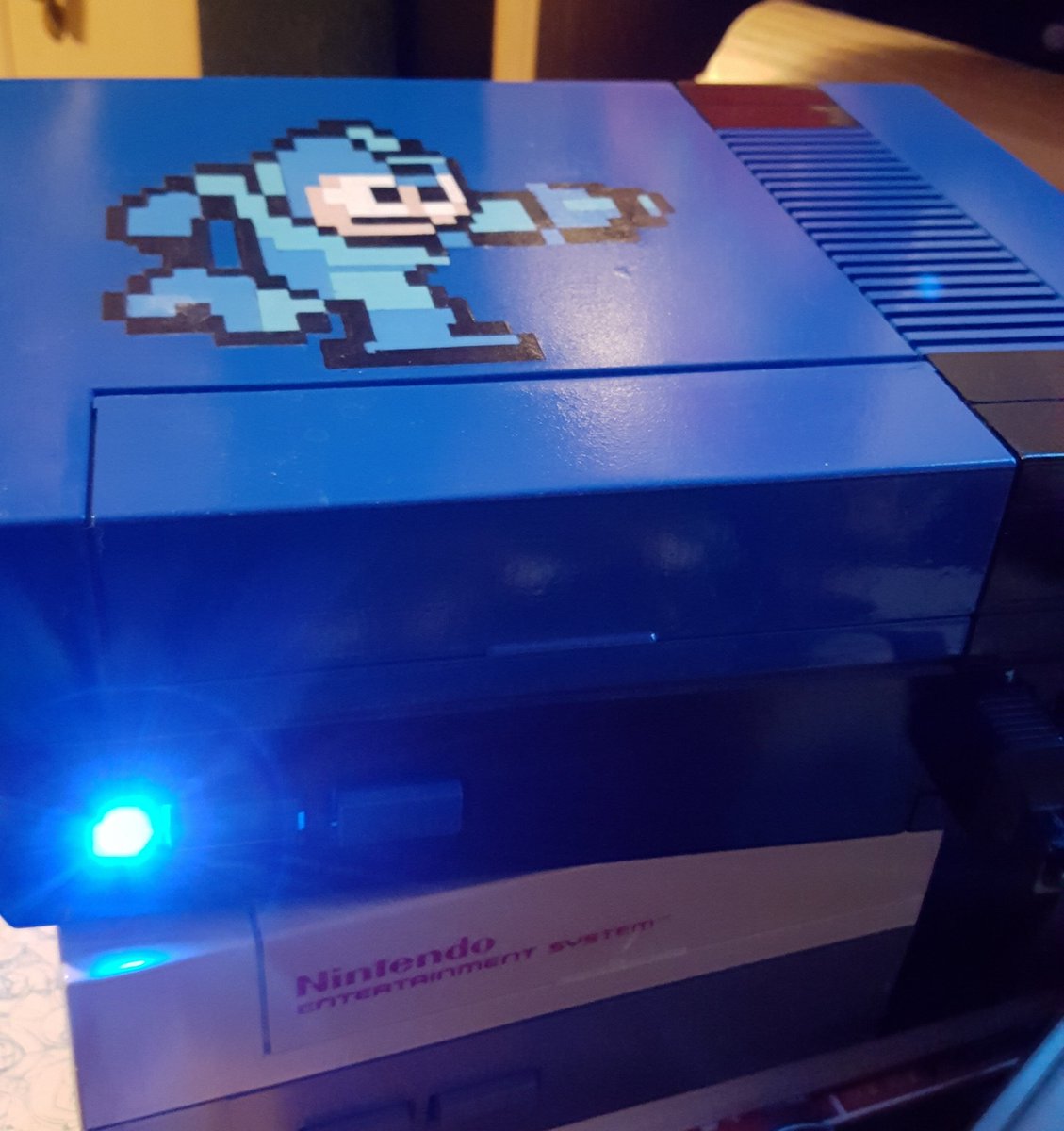 retrogamergirls's tweet photo. Nothing like fixing a 72 pin connector on the NES and removing the lock out chip, yay no blinking! #thingsyoulearnatwork #nes #nintendo #megamannes #blueled https://t.co/W34eltnn4v
