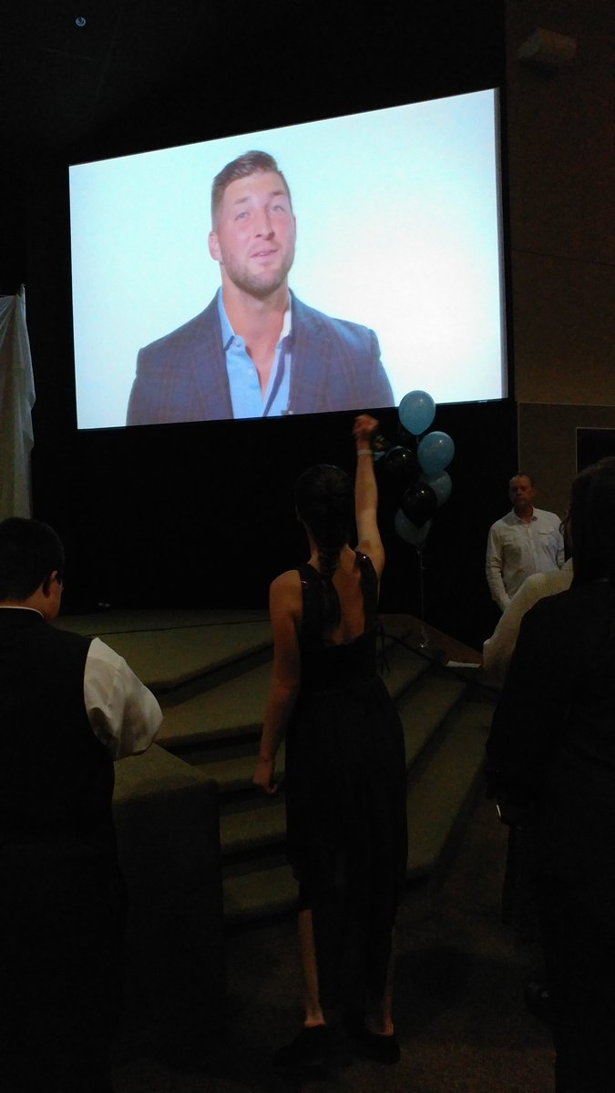 HCCwesterville's tweet photo. Tim Tebow in the house...or on the screen! #TimTebowFoundation #NightToShine #StandWithUs Tim Tebow Foundation https://t.co/FVGIj8onjZ