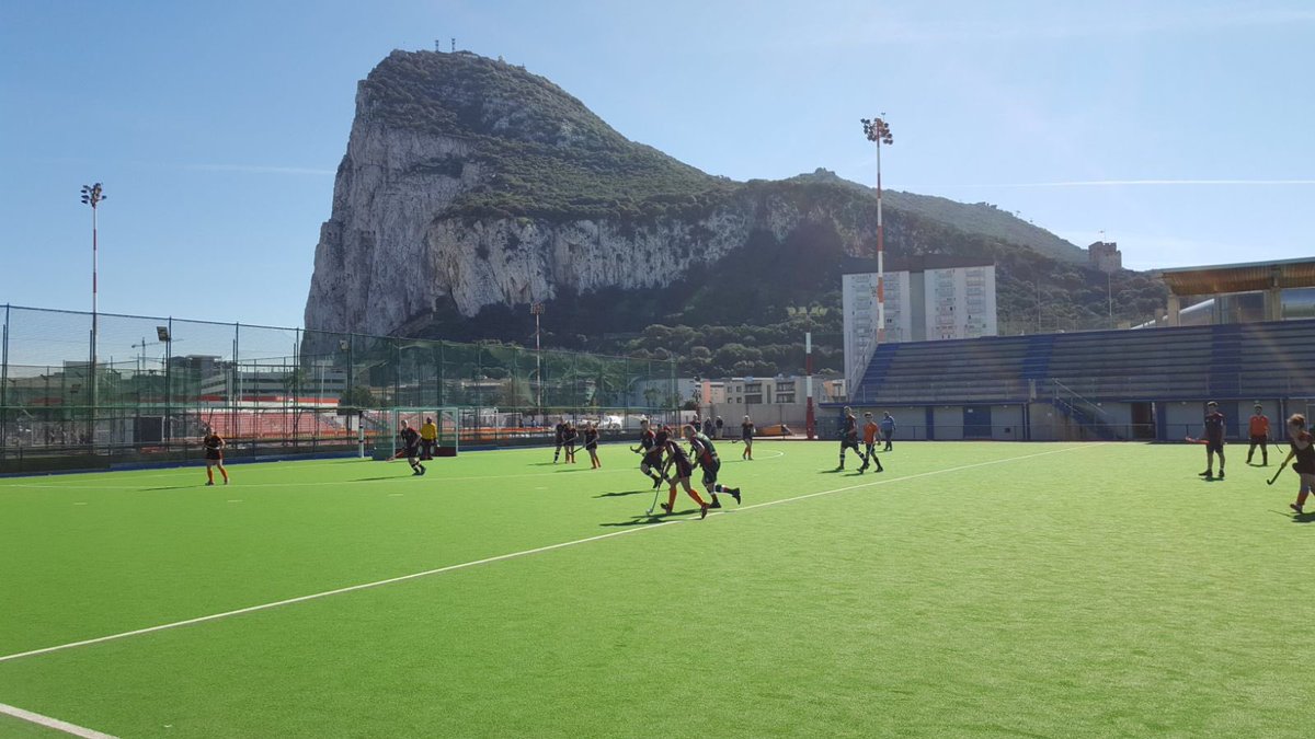 Hockey game underway with ‘The Rock’ in the background.