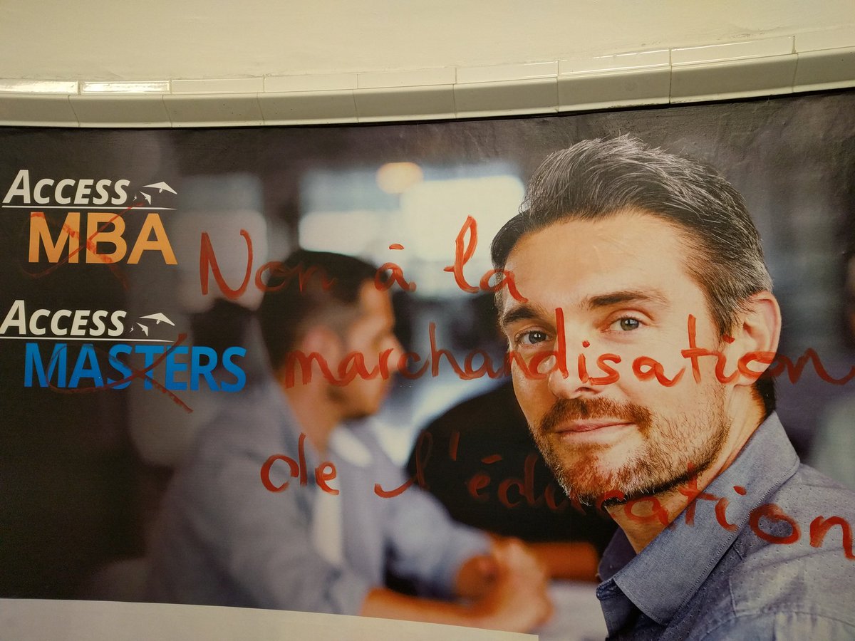 SE_Lomer's tweet image. Graffiti in Paris métro on poster advertising education fair - &quot;no to the marketisation of education&quot; #highered #marketization