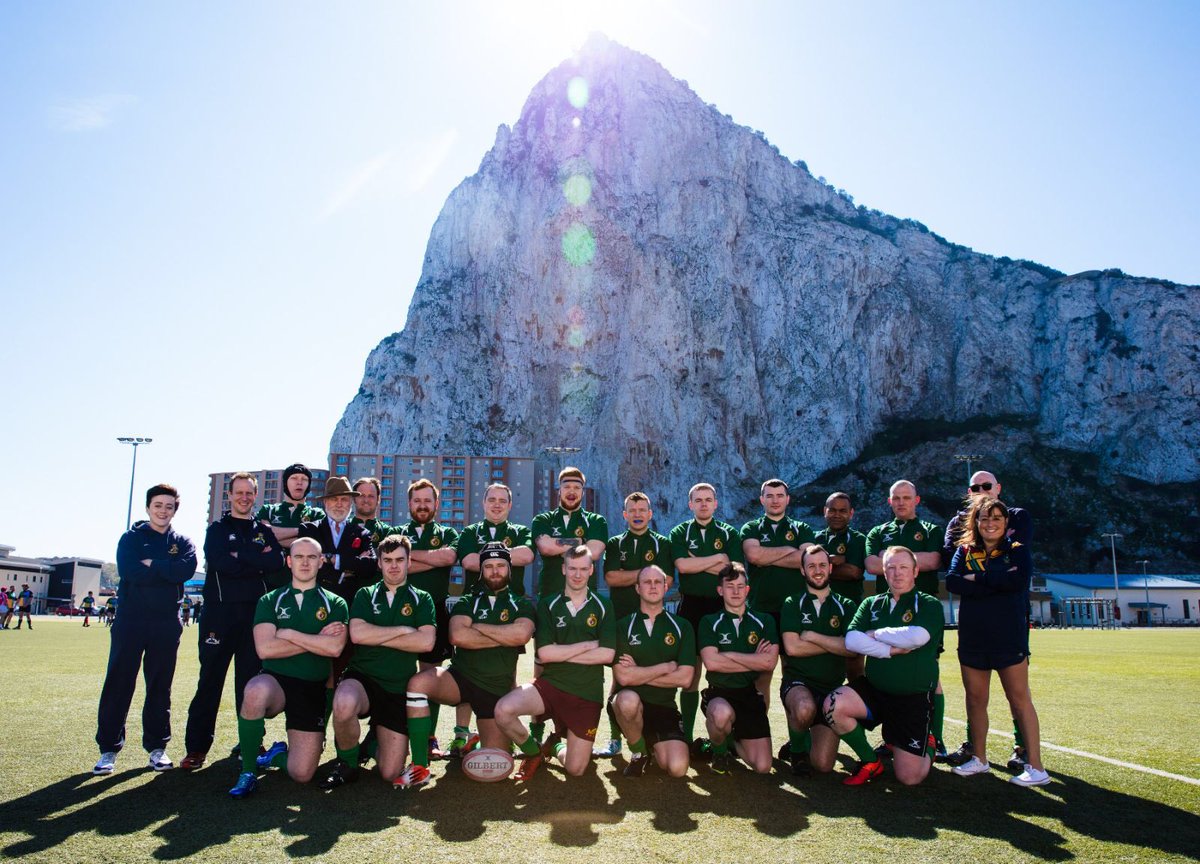 The ship’s rugby first eleven in front of the rock of Gibraltar.