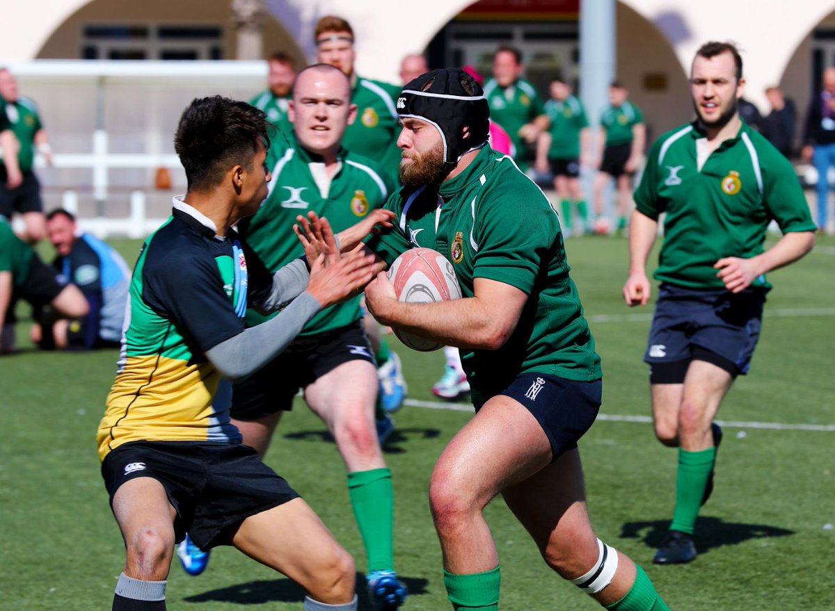 QE player about to pass off a Gibraltar player