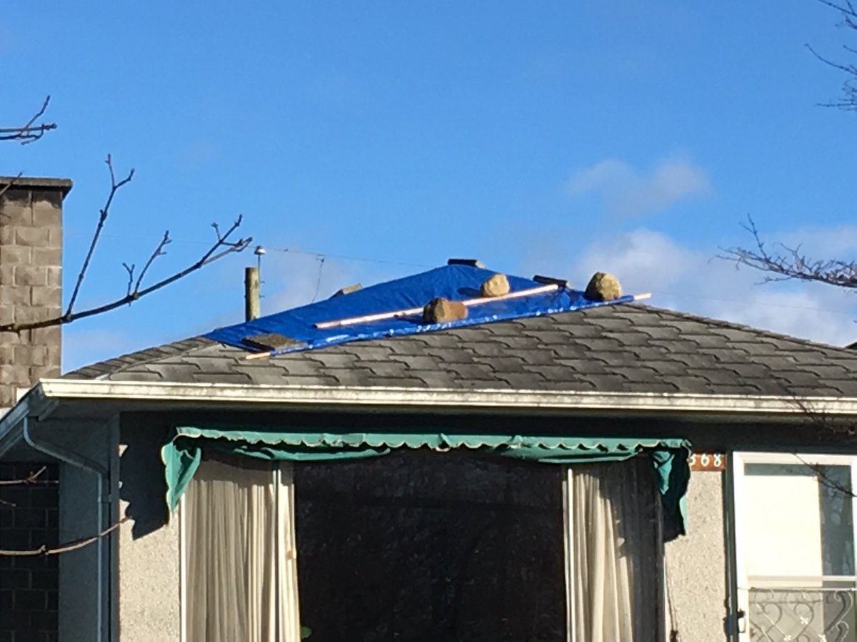 WandaChow's tweet photo. I’m no expert but I suspect this is not the recommended method of securing a tarp on a leaky roof 🙄 #homerepairfail #stayclearonwindydays #helmetsrequired https://t.co/VEereNPw9V