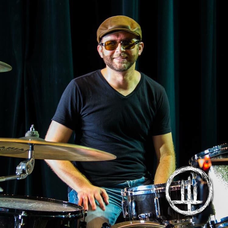 Jeremy hits #Drums with sticks.  They comply and give us #Beats.